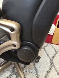 Converted used black leather car seat (AUDI A6) to office swivel reclining chair